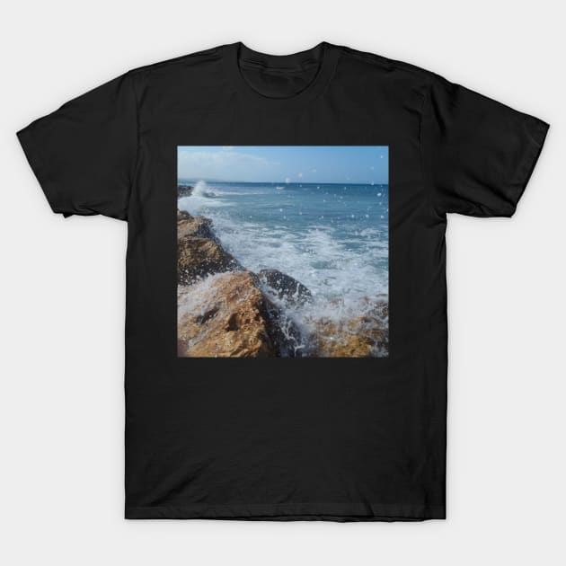 Rock beach, On the rocks, ocean waves surfing the rocks of a splashing dashing restless Caribbean Sea T-Shirt by Artonmytee